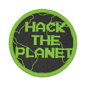 May include: Round patch with the text "HACK THE PLANET" in bright green pixelated font. The text is on a black background with a world map design. The patch has a bright green border.