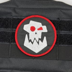 Parche de Orkos: para coser, planchar o con velcro.