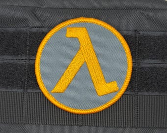 Parche Lambda: para coser, planchar o con velcro.