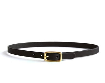 May include: A black leather belt with a gold-toned buckle.