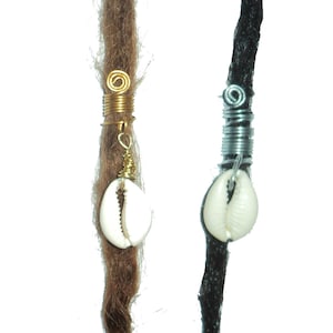 May include: Two dreadlock beads with cowrie shells. One bead is gold and the other is silver.