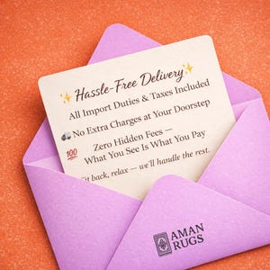 May include: A light purple envelope on an orange background, partially open to reveal a cream-colored card. The card has text that reads "Hassle-Free Delivery" and "AMAN RUGS" at the bottom. The card also includes the text "All Import Duties & Taxes Included".