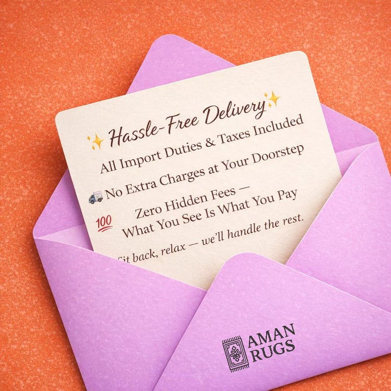 May include: A light purple envelope on an orange background, partially open to reveal a cream-colored card. The card has text that reads "Hassle-Free Delivery" and "AMAN RUGS" at the bottom. The card also includes the text "All Import Duties & Taxes Included".