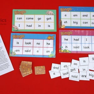 Puede incluir: Un juego de bingo educativo para niños con cuatro tarjetas de bingo coloridas, fichas de palabras e instrucciones. Las tarjetas presentan palabras como "can", "come" y "go". El juego está diseñado para aprender y divertirse.