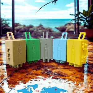 May include: Five miniature, colorful suitcases in shades of tan, green, gray, blue, and yellow are arranged in a row. Each suitcase features a handle and a design resembling a building. A world map with airplane routes is in the foreground.