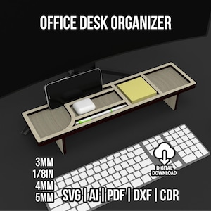 May include: A wooden office desk organizer with compartments for a phone, notepad, and accessories. The organizer is light brown with dark brown trim and is positioned in front of a computer monitor and keyboard. The text "OFFICE DESK ORGANIZER" is at the top.