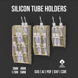 Puede incluir: Tres soportes de madera para tubos de silicona de varios tamaños, cada uno con múltiples tubos. Los soportes son de madera clara y tienen varios niveles. La imagen incluye el texto "SILICON TUBE HOLDERS" y especificaciones de tamaño en mm y pulgadas.