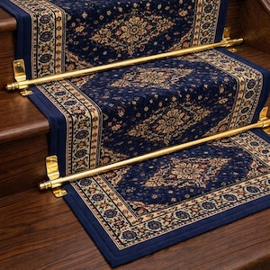 May include: Navy blue stair runners with a traditional floral pattern in beige and gold. The stair runners are secured with brass rods and brackets, adding elegance to the wooden staircase. The carpet is a classic design.