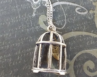 Caged heart-Handmade silver tone bird cage with bronze heart inside