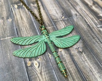 Large vintage style patina dragonfly necklace in a bronze tone