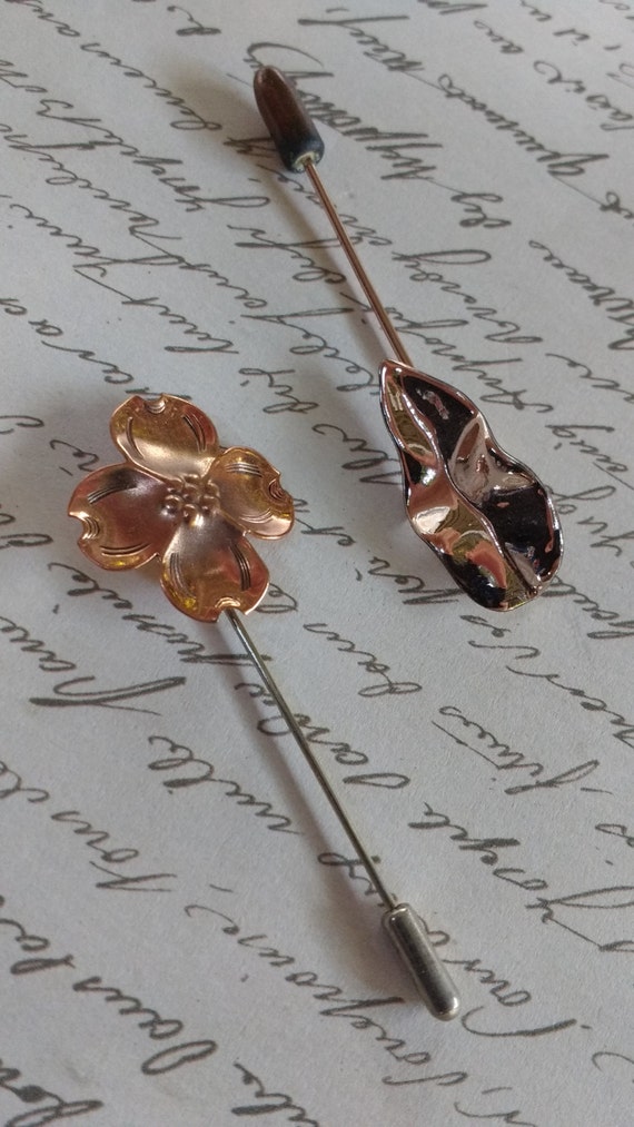 Pretty vintage signed NYE stick pins in a shiny co