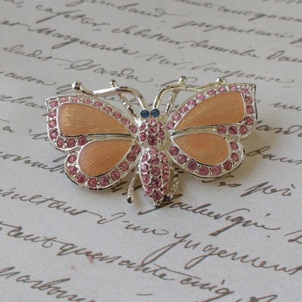 Adorable vintage pink butterfly brooch with rhinestones signed Roman