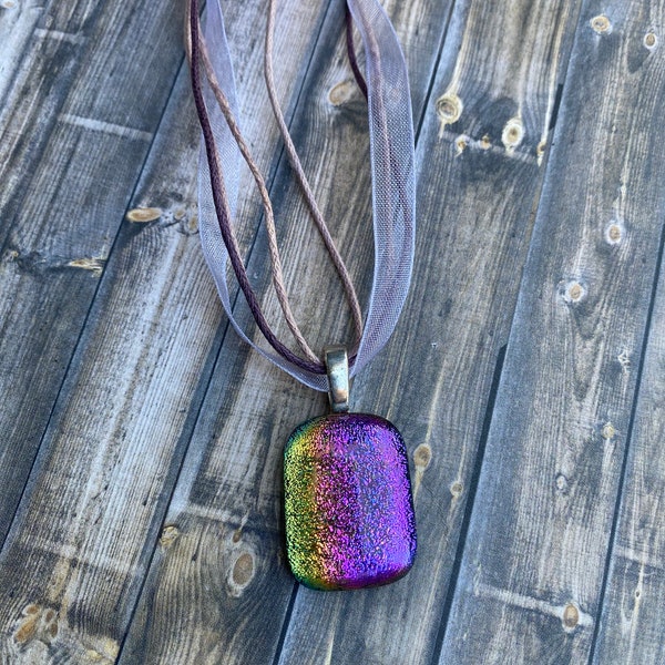 Beautiful glass necklace in shades of vibrant purples and green ammolite stone style