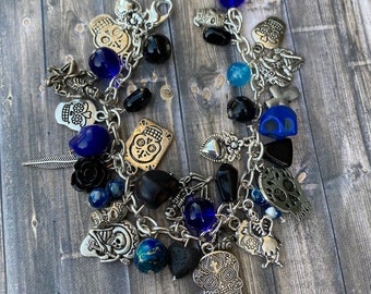 Handmade loaded day of the dead charm bracelet in black and blue