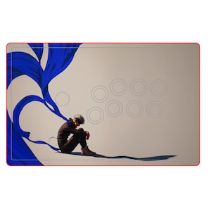 May include: A beige arcade stick with a red border featuring an illustration of a person sitting with their head down. A blue fabric flows from the person's head. The stick has eight gray button outlines.