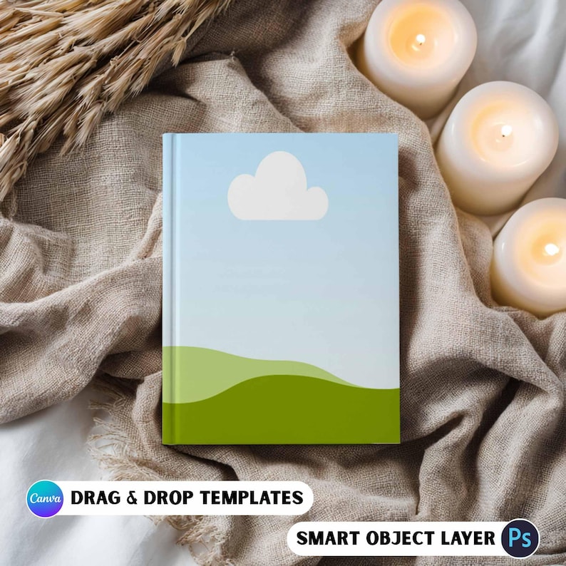 May include: A hardcover book with a sky and landscape design. The cover features a blue sky with a white cloud and green hills. The text "DRAG & DROP TEMPLATES" and "SMART OBJECT LAYER" are visible.