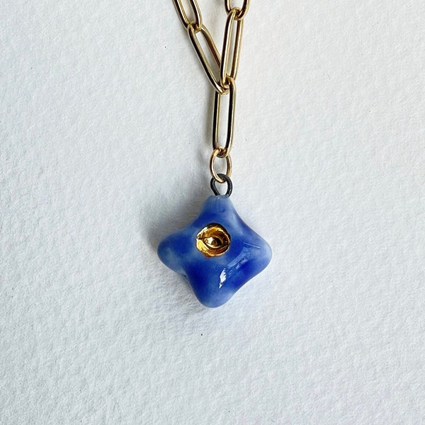 Forget-me-not. Flower. Porcelain charm. Cute, delicate flower charm with gold lustre