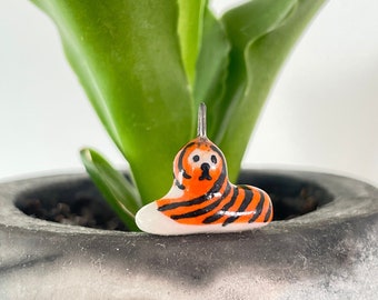 Tiger. Miniature animal. Porcelain charm. Cute, delicate animal charm.