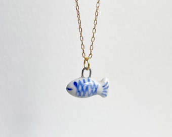 Little fish. Porcelain charm. Cute, delicate fish charm. Hand painted miniature porcelain fish