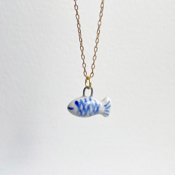 Little fish. Porcelain charm. Cute, delicate fish charm. Hand painted miniature porcelain fish