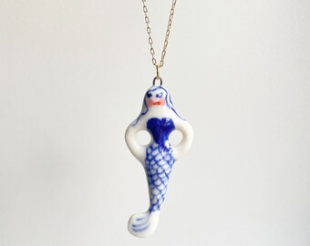 Mermaid. Femininity. Good luck porcelain charm. Cute, sea creature. Pretty lady. Girl power