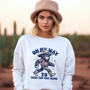 Funny Cowboy Bigfoot Sweater | On My Way to Make the Vibe Weird | Sasquatch Gift | Retro Western Graphic Pullover | Weirdcore Aesthetic