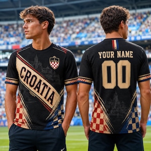 A man wearing a black and gold Croatia soccer jersey with the name "Cromatia" and the number "00" on the back.