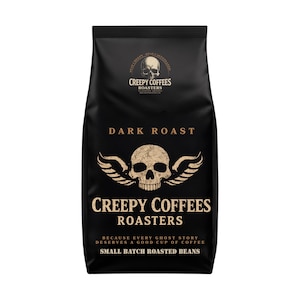 May include: A black bag of Creepy Coffees Dark Roast coffee beans. The bag features a skull with wings and the words "Creepy Coffees Roasters" and "Small Batch Roasted Beans". The text "Because every ghost story deserves a good cup of coffee" is also printed on the bag.