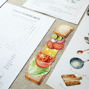 Puede incluir: Conjunto de imprimibles educativos con tem&aacute;tica de reposter&iacute;a. Incluye una sopa de letras, un ejercicio de emparejamiento de vocabulario y una colorida ilustraci&oacute;n de s&aacute;ndwich.