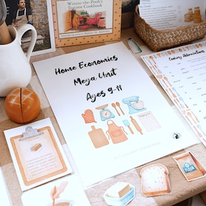May include: A collection of educational materials for home economics, including a workbook titled "Home Economics Mega Unit Ages 9-11", a cookbook, and a chart of cooking abbreviations. The image also features a white pitcher and a decorative orange bread roll.