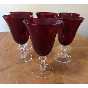 May include: A set of three ceramic mugs with a speckled, matte finish in cream, light grey, and dark grey. Each mug has a simple, minimalist design, suitable for coffee or tea.