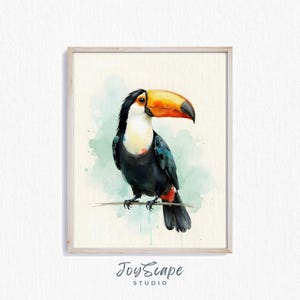 May include: Watercolor painting of a toucan bird perched on a branch. The bird has a large orange and yellow beak, black feathers, and a white chest. The background features a light green watercolor wash. The artwork is framed in a light wood frame.