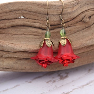 May include: Red rose flower earrings with green glass beads and gold accents.