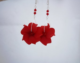 May include: Red flower dangle earrings with silver hoops and red crystal beads.