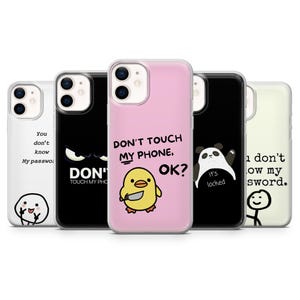 May include: A collection of phone cases with various designs and text. One case is pink with a yellow chick holding a knife and the text "DON'T TOUCH MY PHONE, OK?". Other cases feature a panda, a stick figure, and other graphics.