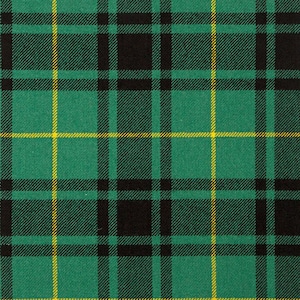 May include: A close-up of a green, black, and yellow tartan pattern. The design features a repeating grid of intersecting lines, creating a classic plaid appearance. The fabric has a textured appearance.