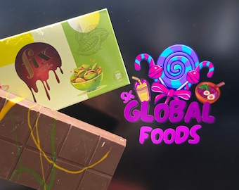 May include: A close-up of chocolate bars and packaging. One bar is decorated with green and yellow lines. The packaging features the word "fix" with a dripping design, a bowl of pistachios, and the text "200 grm". The logo "SK GLOBAL FOODS" is also visible.