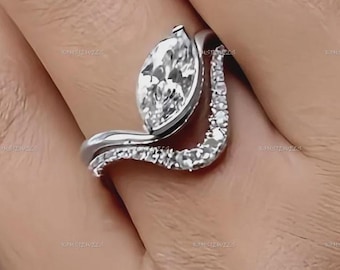 Set di anelli di fidanzamento/matrimonio con moissanite taglio marquise da 1,5 carati e diamanti, incastonatura bassa a semi-castonatura su fascia in oro bianco 18 carati con pavé di diamanti a onda. Set di anelli di fidanzamento per lei.