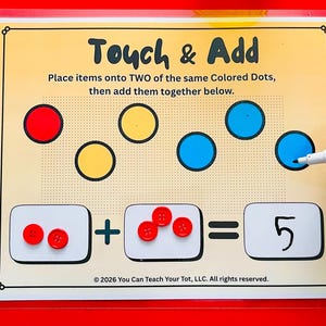 May include: Educational math game with the title "Touch & Add". The game features red, yellow, and blue circles, along with red buttons used for counting. The final answer is 5. The text says "Place items onto TWO of the same Colored Dots, then add them together below."