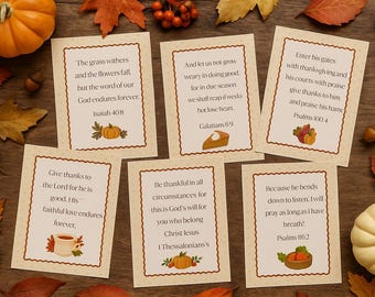 May include: A collection of six cards with Bible verses, featuring autumn-themed illustrations of pumpkins, pie, and gourds. The cards are surrounded by fall leaves, acorns, and pumpkins, creating a seasonal display.