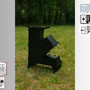 Può includere: Una stufa a legna in metallo nero con un design angolare unico, posizionata su una superficie erbosa. La stufa presenta un camino e sezioni laterali angolate. L'immagine include il testo "TEC design" e "M.H designer".