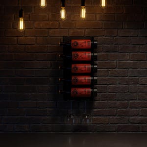 May include: A black wine rack mounted on a brick wall, holding six bottles of wine with red labels. Three wine glasses hang below. Edison-style light bulbs hang from the ceiling, illuminating the scene.