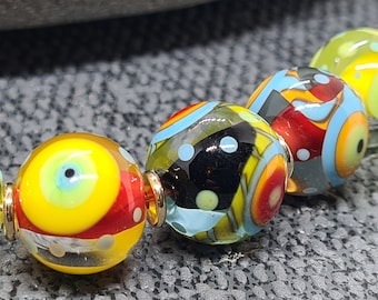 Set van 7 ingekapselde polkadotkralen - lampworkkralen - op bestelling gemaakt