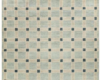 May include: A rectangular area rug with a grid pattern. The rug features a light blue background with beige squares and dark blue accent squares. The text "Bazarknots" is in the upper right corner.