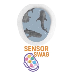 May include: A white circular patch with a blue background featuring three whale shark illustrations. The patch is surrounded by a white border. Below the patch, the text "SENSOR SWAG" is displayed above a design of a sensor with smiley faces.