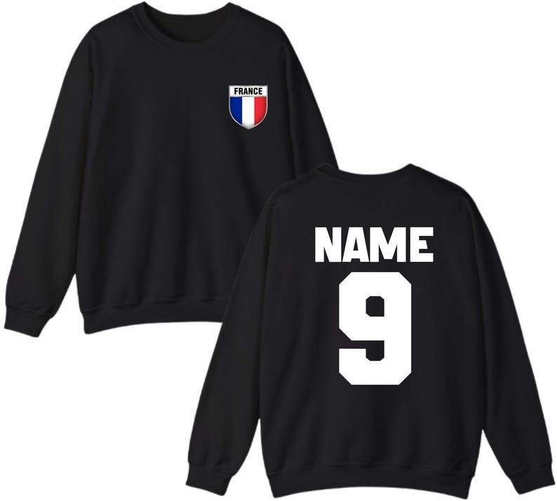 May include: Black sweatshirt with the word "NAME" and the number "9" in white on the back. A small shield with the French flag and the word "FRANCE" is on the front.