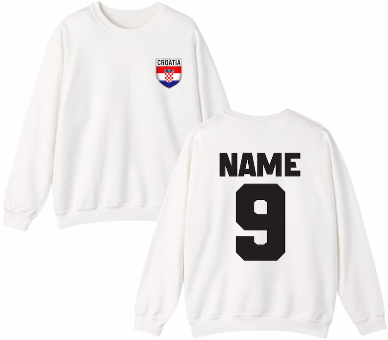 May include: White sweatshirt with the Croatian flag emblem on the front. The back of the sweatshirt features the word "NAME" above the number "9" in black block letters. A casual, sporty design.