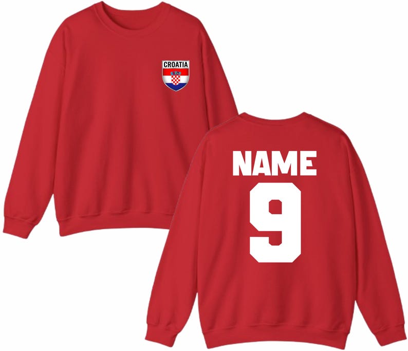 May include: Red sweatshirt with the Croatian flag emblem on the front and the word "NAME" and the number "9" on the back. The sweatshirt is a crew neck style.