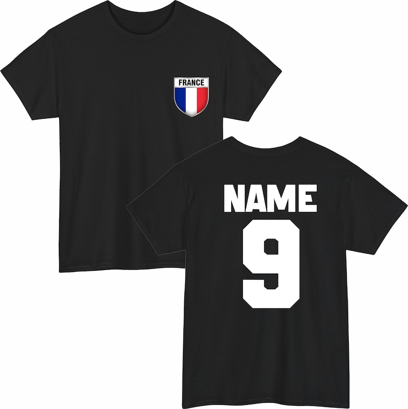 May include: Black t-shirt with a French flag emblem on the chest. The back of the shirt displays the word "NAME" above the number "9" in white block letters. A sporty design.