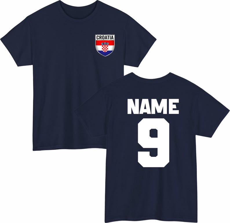 May include: Navy blue t-shirt with the Croatian flag emblem on the front and the word "NAME" and the number "9" on the back. The Croatian flag emblem is red, white, and blue. The text and number are white.